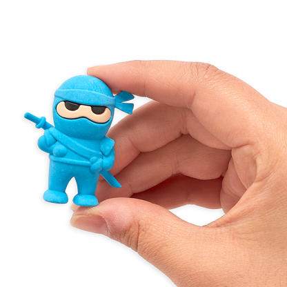 Hand holding up blue Ninja Eraser