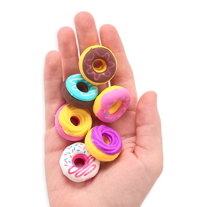 Hand holding all Dainty Donuts Erasers