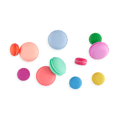 OOLY Le Macaron Patisserie Scented Erasers spread out on pages