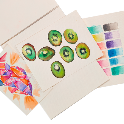 Colorful watercolor art created on Chroma Blends Watercolor Paper Pad fanned out