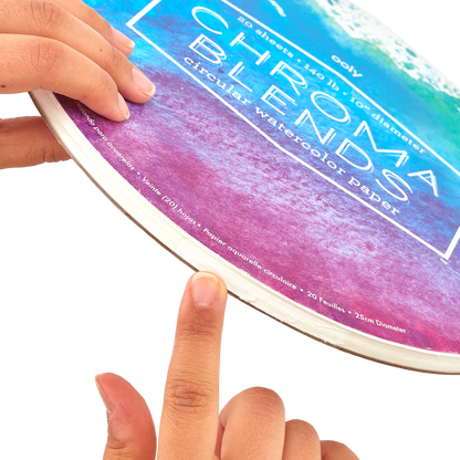 Finger pointing to the opening of the binding of the Chroma Blends Circular Watercolor Paper