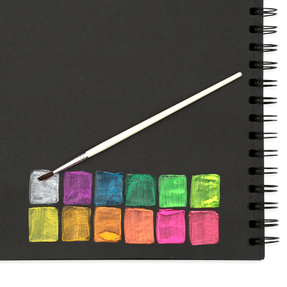 Chroma Blends Neon Watercolor Set color swatches on black paper with brush