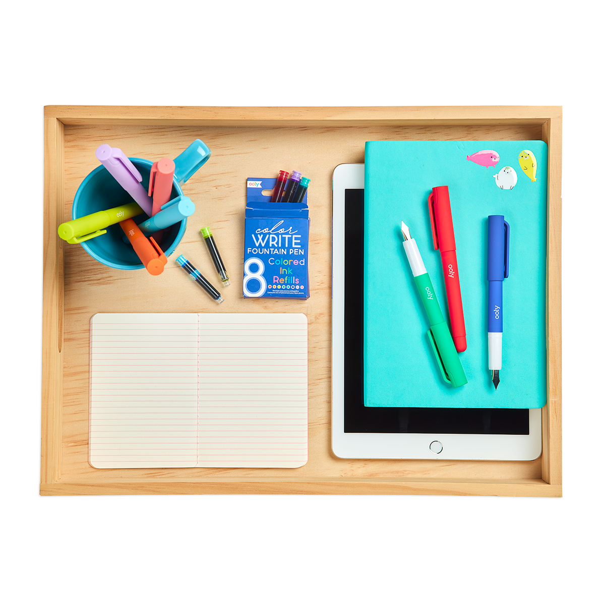 Color Write Fountain Pens with a notebook on a office desktop