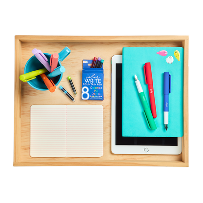 Color Write Fountain Pens with a notebook on a office desktop