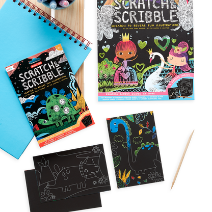 Dinosaur Days Scratch and Scribble Mini Scratch Art Kit next to the Princess Garden Scratch and Scribble Art Kit. 