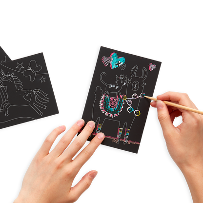 Hands drawing on the Funtastic Friends Scratch and Scribble Mini Scratch Art Kit