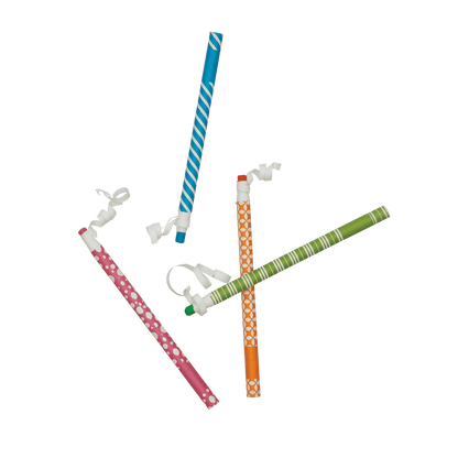 Four OOLY Color Appeel Crayon Sticks scattered in a top down view
