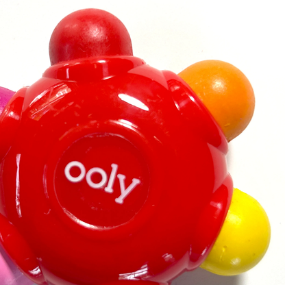 Close up of red grip crayon from set of OOLY Color Burst Crayons
