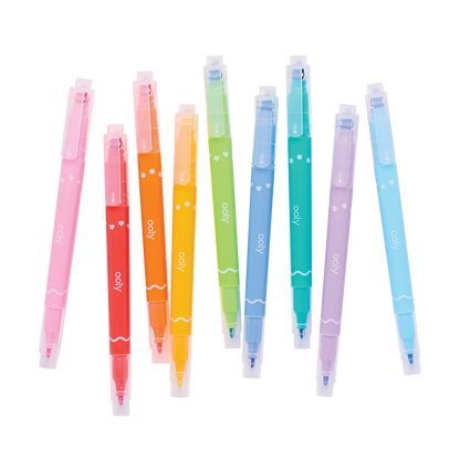 Scattered row of capped OOLY Confetti Stamp Double-Ended Markers