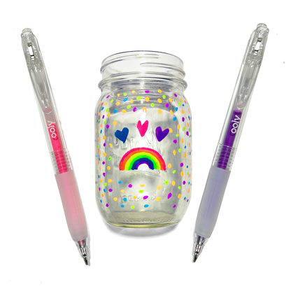 Colored pens and a jar colored with hearts and a rainbow made with OOLY Jelly Gloss Neon Multi-Surface Deco Gel Pens