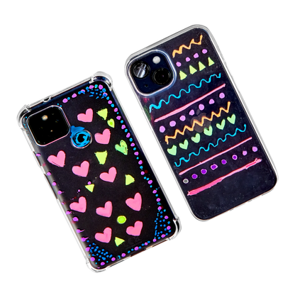 Two phone cases decorated with OOLY Jelly Gloss Neon Multi-Surface Deco Gel Pens