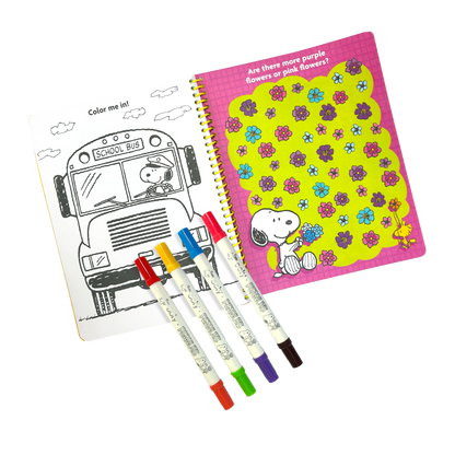 Opened activity book with coloring page and 4 markers from the OOLY x Peanuts Activity Travel Kit & Double-Ended Markers set