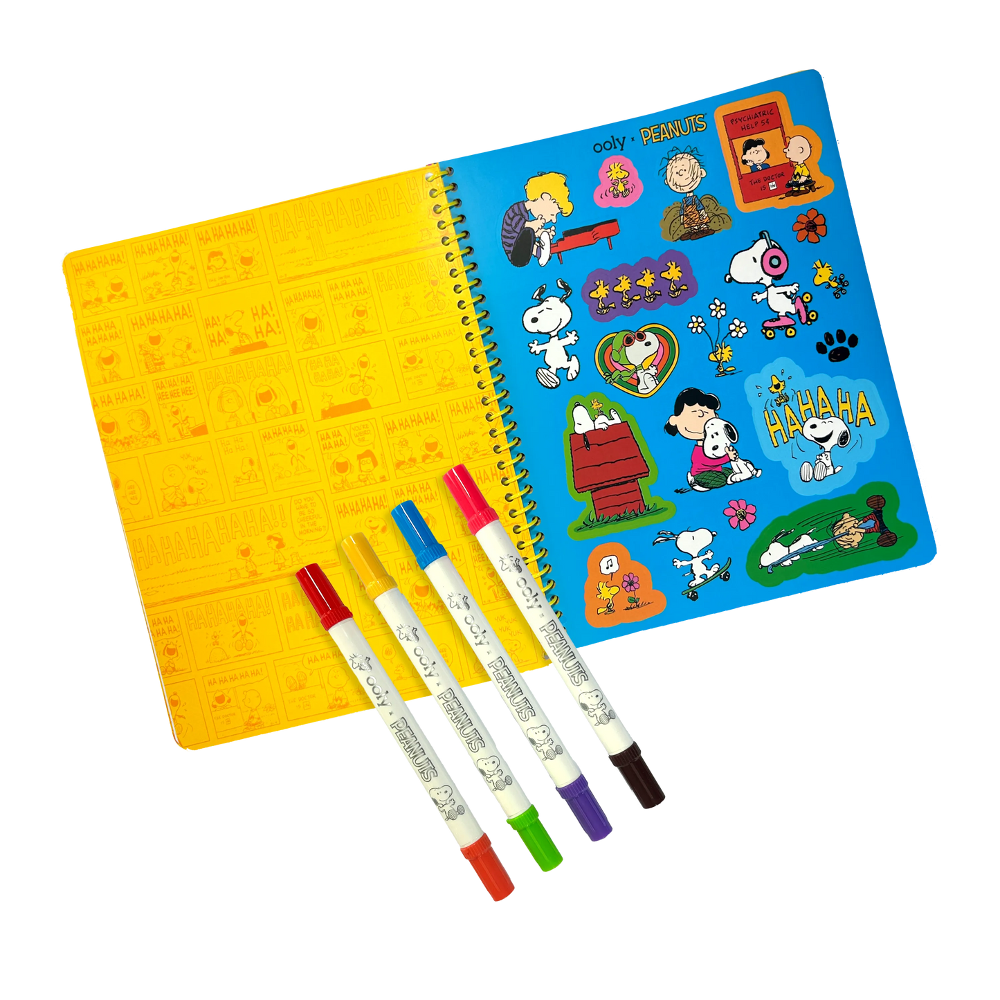Opened activity book on sticker page with 4 markers from the OOLY x Peanuts Activity Travel Kit & Double-Ended Markers set