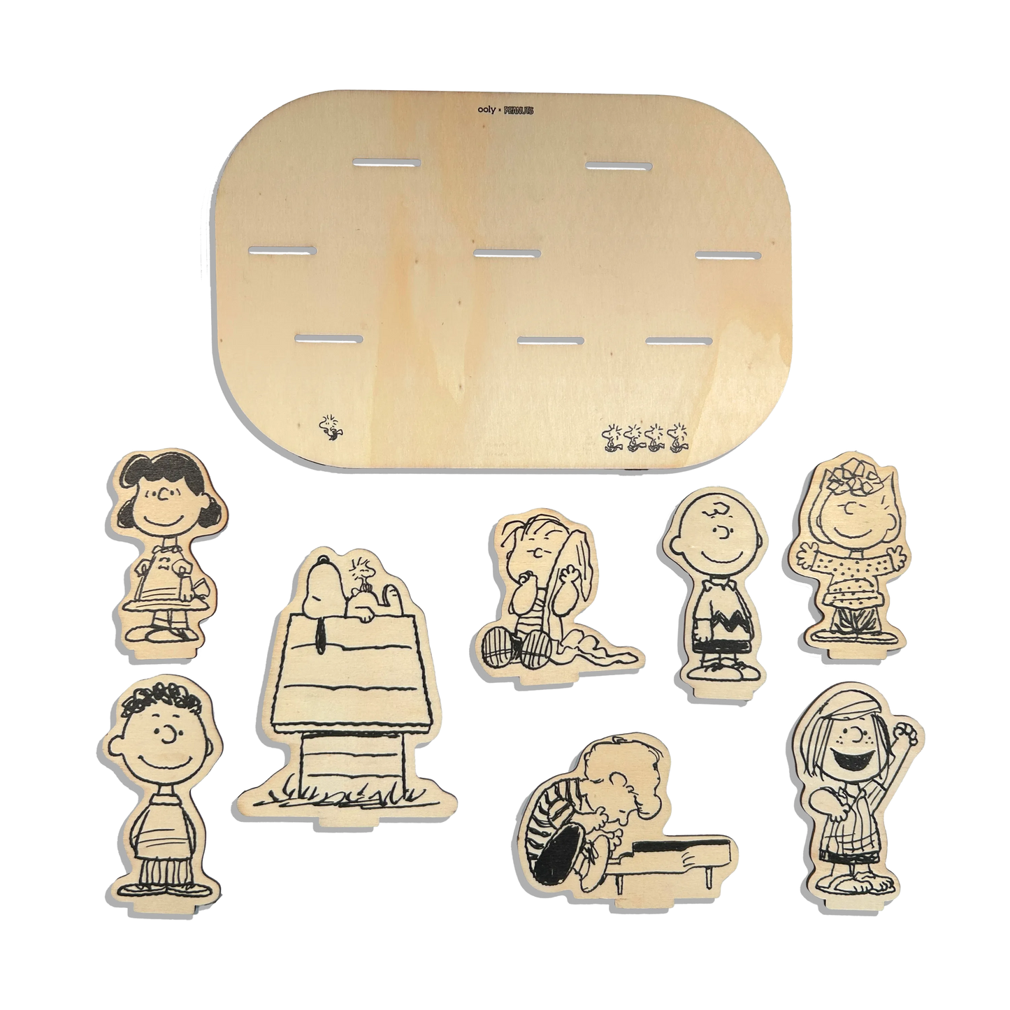 Flat lay of all wooden pieces in the OOLY x Peanuts Color-In Wooden Scene Kit