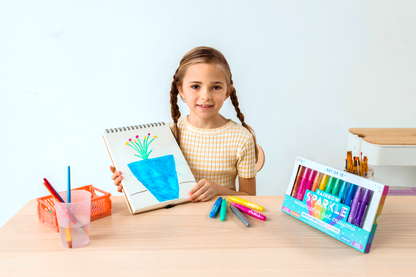 Girl holding completed coloring of blue flower pot with OOLY Rainbow Sparkle Metallic Watercolor Gel Crayons