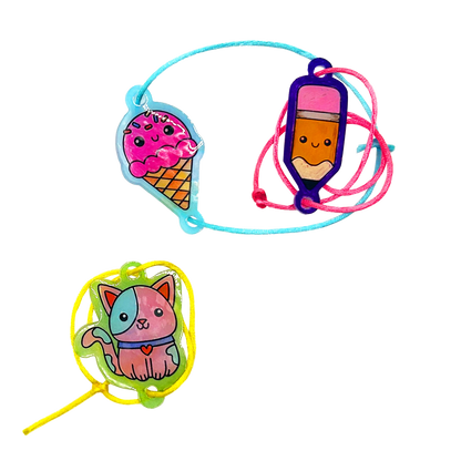 Finished ice cream, pencil and cat bracelets from OOLY Shrink-its! DIY Shrink Art Bracelet Kit - BFF