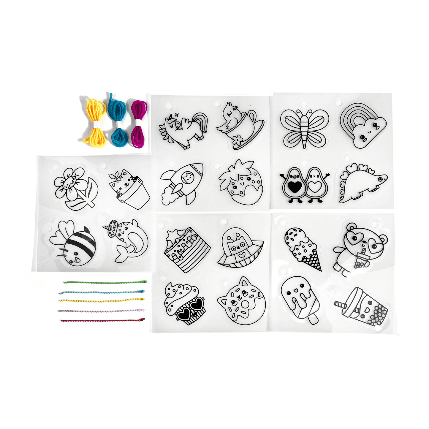 Contents of OOLY Shrink-its! DIY Shrink Art Kit - Cute Crew including shrink sheets, colored cords and colored ball chains