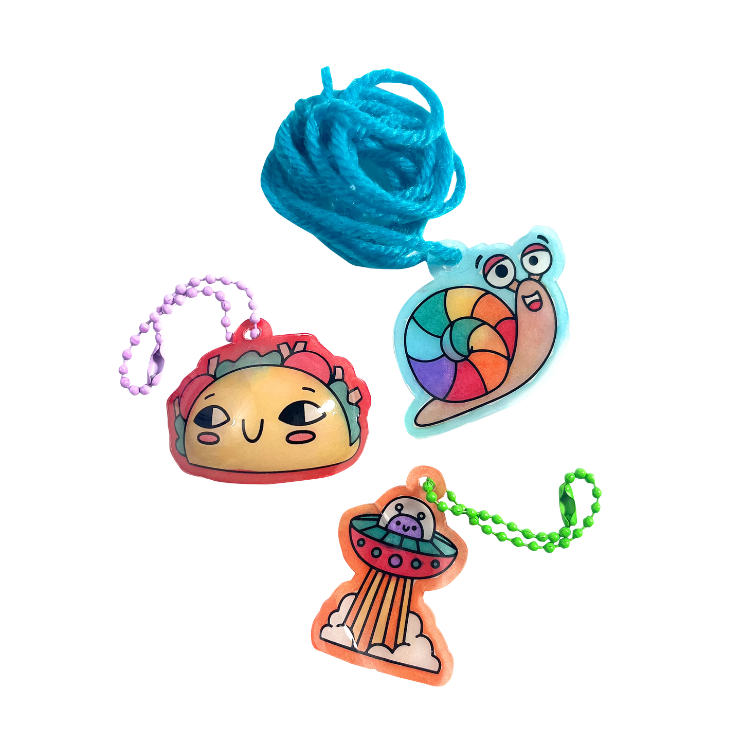 Finished charms of taco, snail and UFO from Shrink-its! DIY Shrink Art Kit - Fun Friends
