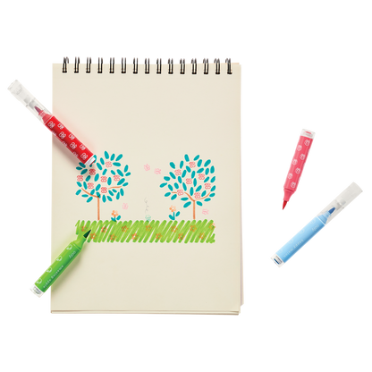 Coloring of green trees and grass in white sketchbook with stamp patterns from Stampables Double-Ended Stamp & Brush Markers