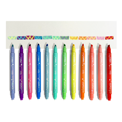 Row of uncapped markers and color changed swatches from OOLY Switch-Eroo Sparkle Glittery Color Changing Markers