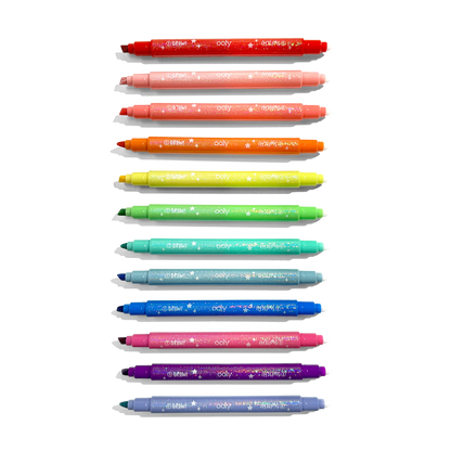 Row of uncapped markers from OOLY Switch-Eroo Sparkle Glittery Color Changing Markers