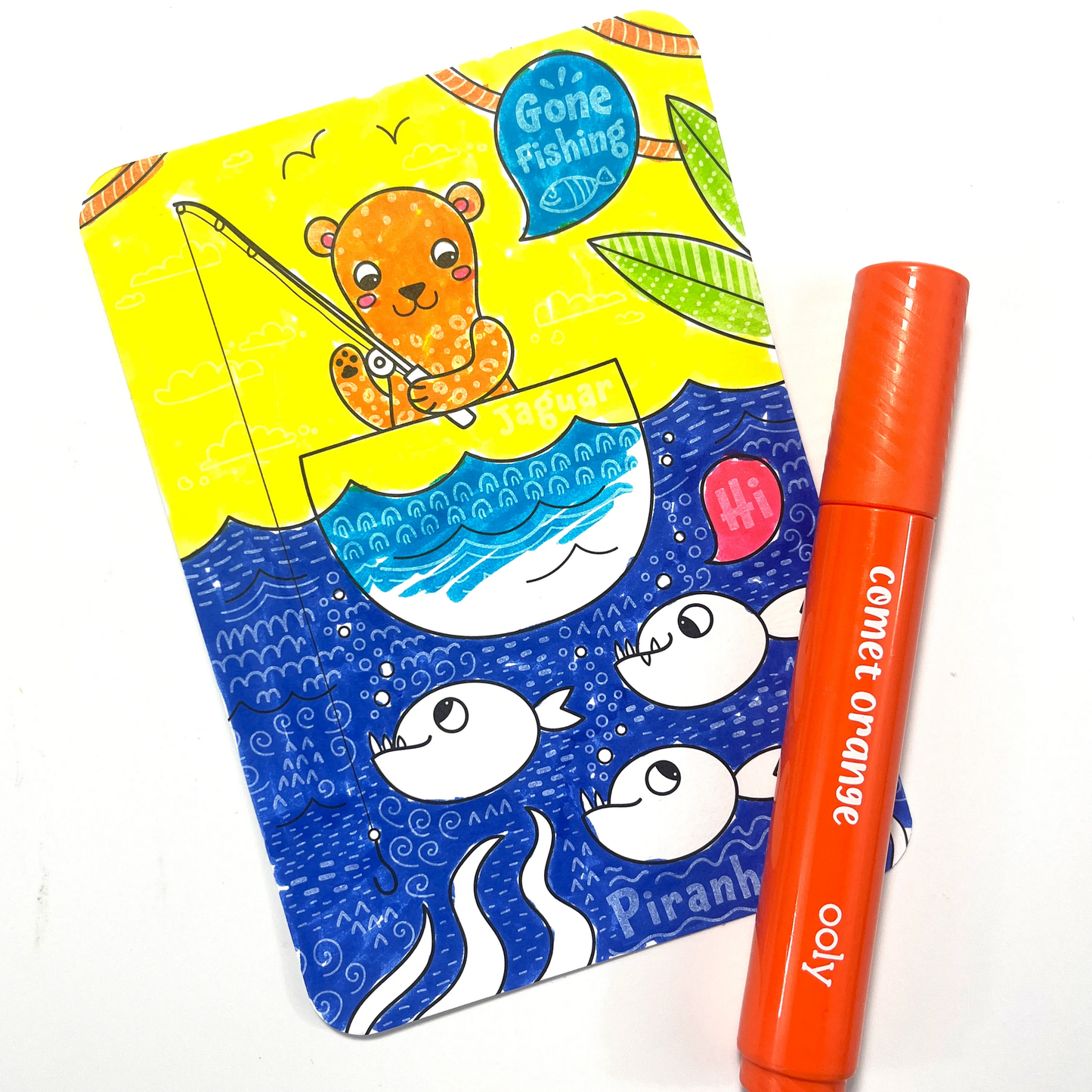 Colored card from the OOLY Undercover Art Hidden Pattern Coloring Activity Art Cards - Rainforest Fun set with orange marker