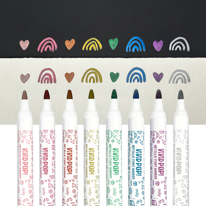 Row of OOLY Metallic Vivid Pop! Water Based Paint Markers with swatches on white and black paper